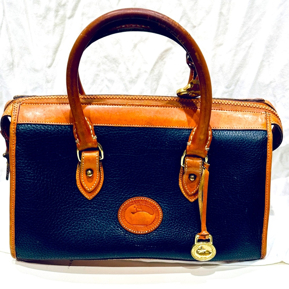 Vintage Dooney & Burke handbag, leather. Navy blue with tan accents.